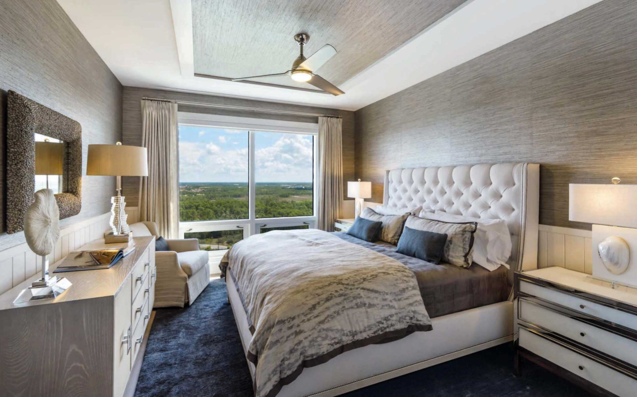 In the comfortable guest room, Vanguard’s mid-century style bed with its tufted headboard pairs nicely with cabinetry from John-Richard and Bernhardt’s bedside chests. A “Sabrina” lounge chair swivels to enjoy the view, while a charcoal-hued area rug from Loloi grounds the private space in warmth.